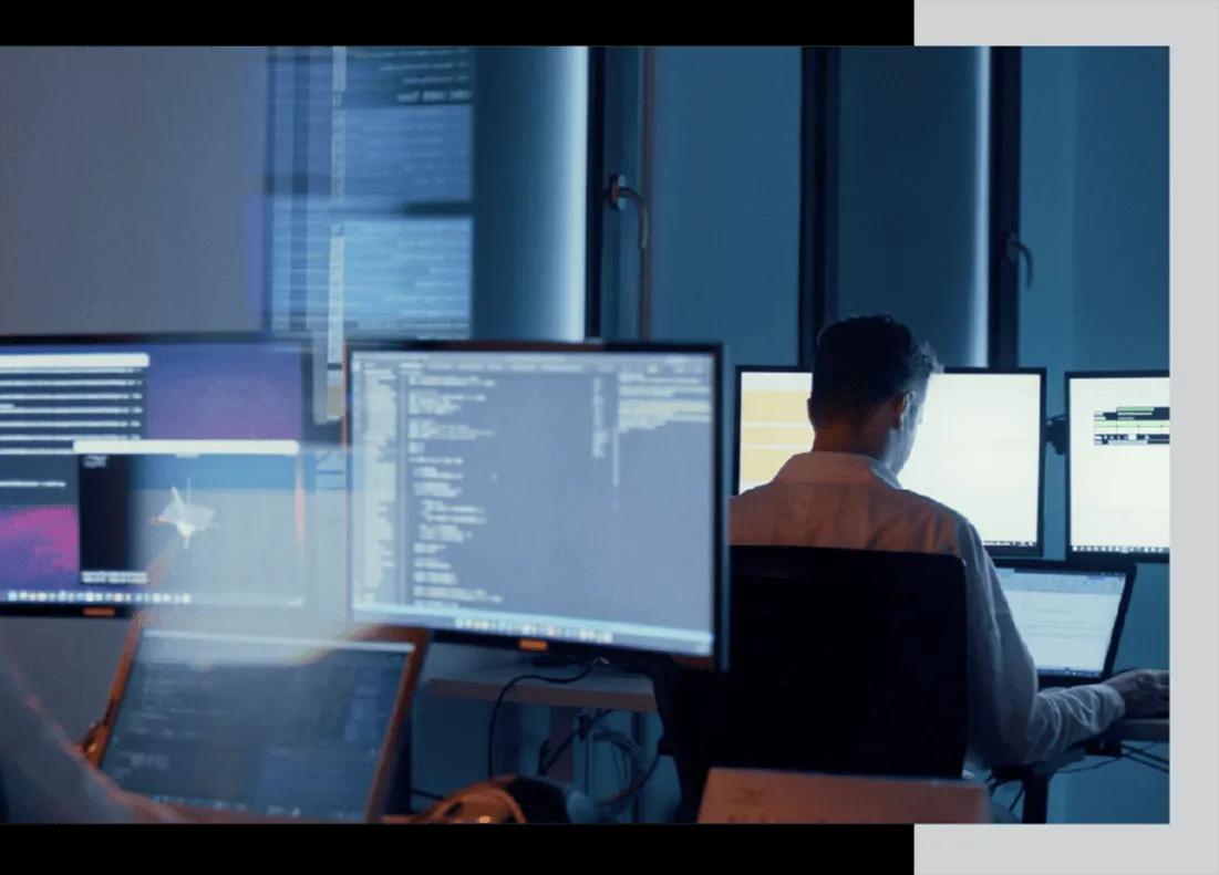 Argotec engineer at a mission-control style workstation